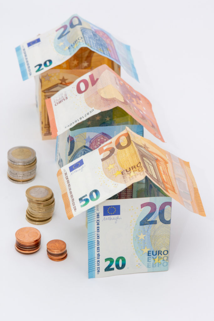 Houses made of euro banknotes